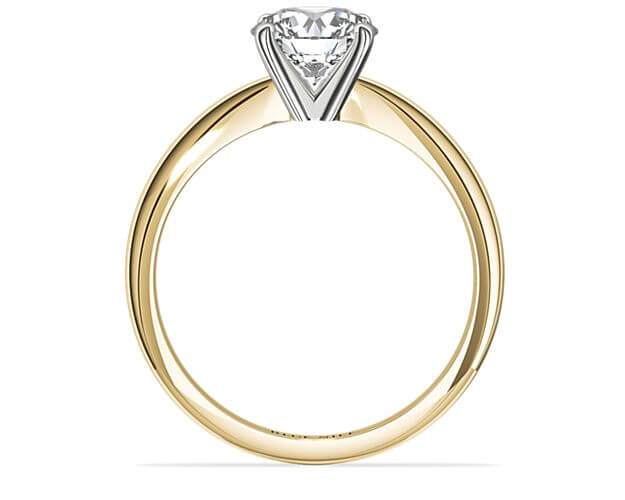 Blue Nile four prong solitaire engagement ring in yellow gold